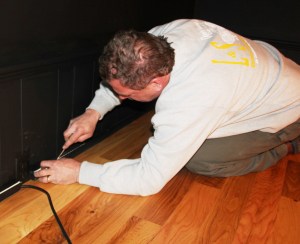 Larry McCullion, of L & S Electrical Construction, works on the final touches.