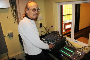 Jack Kulp stands inside the new sound and light booth.