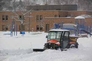 Tamaqua Area School District maintenance worker Matthew Delborrello plows the sidewalk and grounds around the Tamaqua Elementary School.