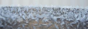 PHOTO TAKEN BY VALERIE FOGARTY Surface frost on a wooden porch railing in West Penn Township.