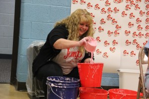 Teacher Michele Bittner shows the pink slime.