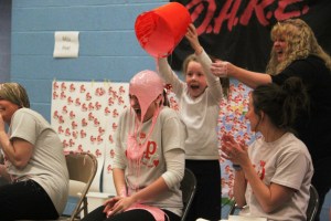 Teacher Abby Neverosky gets slimed by student Ashlynn Houser.