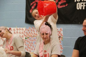 Teacher Erika Davis gets slimed by student Jillian Tite.