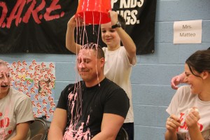 DARE officer Jason Lorah (filling in for teacher Michele Bittner) gets slimed by Ethan Amershek.