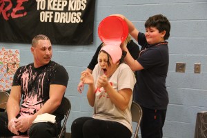 Teacher Caitlyn Ligenza gets slimed by student Ryan Snyder. Ryan raised the highest amount of donations for the American Heart Association.