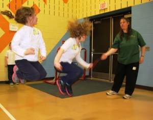 Addison Krall, 6, left, jump ropes with Abby Whitehead, 6.