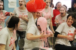 Teacher Marta Monk gets slimed by student Addison Krall.