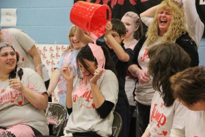 Teacher Jen Kinder gets slimed by student Tyler Steigerwalt.
