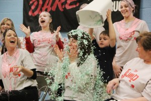 Teacher Dorothy Sassaman has confetti thrown on her by Brandon Bennett.