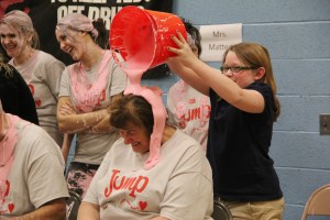 Custodian Patty Turton gets slimed by student Marissa Miller.