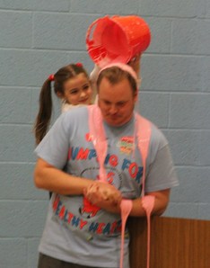 Teacher Tim Gombar gets a surprise slime from Grace Kinder.