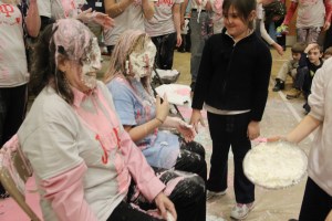 Teachers Vanessa Boyle and Harriet Gustus receive a pie in the face as part of the accelerated reading program.