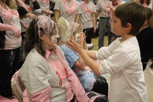 Teachers Vanessa Boyle and Harriet Gustus receive a pie in the face as part of the accelerated reading program.