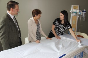 Kim Sargent, VP of Patient Care Services, St. Luke’s Miners Campus (far right) demonstrates the advanced capabilities of the hospital’s patient beds for Peggy Sue O’Donnell, 2014 Black Diamond Garden Party Honorary Chair and Micah Gursky, Director of Development, St. Luke’s Miners Campus. Proceeds from the 2014 Black Diamond Garden Party will purchase beds with advanced options to help patients heal and clinicians provide efficient patient care.