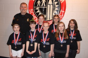 Pictured from front left are top D.A.R.E. essay winners Molly Murphy (Mrs. Faust's class, Tamaqua Elem.), Terra Steigerwalt (Mrs. Bitter's class, West Penn Elem.), Sophia Boyle (Mrs. Setser's class, Tamaqua Elem.), and Page Gittens (Mrs. Faust's class (Tamaqua Elem.).  From back left are DARE officer Corporal Dwayne Hacker (Tamaqua Police Department), essay winners Alexus Warne (Mr. Gombar's class, West Penn Elem.), Caitlin Smith (Mr. Peters's class, Tamaqua Elem.) and Kayla Weiser (Ms. Parker's class, Tamaqua Elem.).  Not pictured is Samuel Sterns (Mrs. Roberts's class, St. Jerome School).