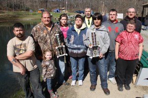 Pictured in front are catchers of the largest fish, Isabella Weber, 4, with a 20 3/4 fish and Tyler Schock, 15, with a 22 1/4 fish. Back row from left are association members Jason Wersinger, president Tom Keerans, secretary Carol Keerans, Jessie Eick, vice president Jack Wassell, trustee Joe Knepper Jr., Joe Knepper Sr.