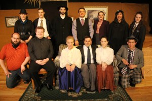 Pictured from front left are director Zane Bachert, Kevin Killian (Rev. Dr. Harper/Mr. Witherspoon), Kandy Kraemer (Abby Brewster), costume designer Jonathan Rodgers (Teddy Brewster), Jessica Schafer (Martha Brewster), and Jacob Gursky (Dr. Einstein). From back left are Tina Becker (Lieutenant Rooney), Tim Solarek (Officer Brophy/Mr. Gibbs), Luke Swierczek (Jonathan Brewster), Chris Pavlick (Mortimer Brewster), Aimee Hull (Elaine Harper), Sophia Gursky (Officer O'Hara) and assistant director Erika Cassell (Officer Klein).