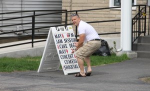 Shannon Rega Placing Sign Out Front of Community Arts Center, Tamaqua, 5-5-2014 (3)