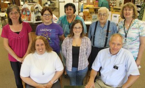 Volunteers pictured from front left are Jolene Barron (board member), Khayla Zaprazny and Steve Tichy. From back left are Susie Schlosser (board member), Rachael Goetzke, Evelyn Lesniak, Bob Betz (board member) and Gayle Heath (library director).
