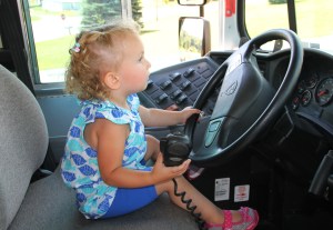 Girl at Drivers Seat of School Bus, Truck Show, Fire Company, West Penn, 8-17-2014 (1)