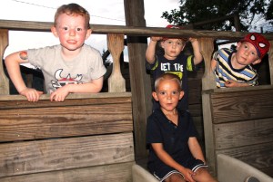 Playing on the wooden jungle gym are, from left, Sam Shafer, who turned 4 yesterday; Travis Carlino, 4; Daniel Schroeder, 2; and Ethan Schroeder, 4.