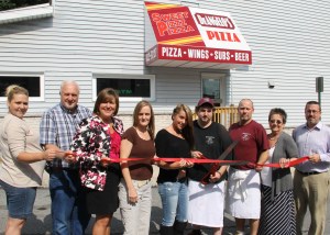 Pictured during the ribbon cutting (from left) were Sadie Paisley, bartender; Tom Banditelli Sr., member, Tamaqua Area Chamber of Commerce (T.A.C.C.); Linda L. Marchalk, member, T.C.A.C.; Joan Callaghan, assistant manager; Amanda Thomas, bartender; Louis DeAngeles Jr., cook; Mark Belaus, cook; Linda Yulanavage, Executive Director, T.A.C.C.; and Richard Hadesty Jr., member, T.A.C.C.  Missing was owner William "Billy" H. Phillips.