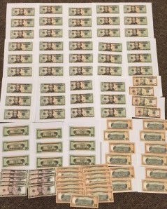 Pictured are uncut bills found in Sanders vehicle/Photo Courtesy Rush Township Police Dept.