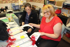 Tamaqua Salvation Army volunteers Dina Depos, left, and Melissa Latham prepare hundreds of Angel Tree tags in preparation for December's toy distribution.