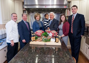 Koch’s Turkey Farm and Yuengling will be the Thanksgiving meal for the Commonwealth’s First Family. Standing in the Governor’s Residence kitchen are, from left to right, Executive Chef Barry Crumlich, Senator Argall, first lady Susan Corbett, Governor Corbett holding his grandson, Liam, Elise Argall and Brock Stein. 