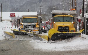 TamaquaArea.com File Photo/PennDOT trucks use two trucks to clear North Railroad Street in Tamaqua.