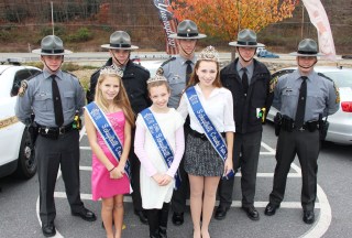 Posing for a photo with PA State Troopers are Schuylkill County Fair royalty, from left, Princess Kaylee Yeager, Little Miss Haley Rymarkiewicz, and Queen Alexandra Mullin. Troopers pictured, from left, are troopers Caleb Huber, Corporal David Mayes, Lieutenant Craig Stine, Peter Mohn, and Sgt. Scott Ohl. 