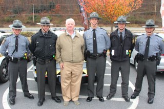 Pictured from left are troopers Caleb Huber, Corporal David Mayes, PA Representative Jerry Knowles, Lieutenant Craig Stine, Peter Mohn, and Sgt. Scott Ohl.