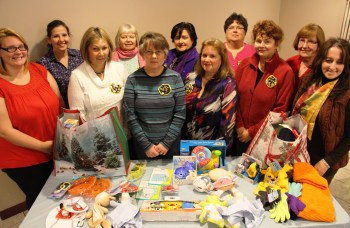 Pictured from front left are Tamaqua Salvation Army volunteer Melissa Latham, sorority members Helen Walters, Mary Machay, Donna Gerber, Cathy Santee and Lori Schmerfeld. From back left are Tamaqua Salvation Army programs director Dina Depos, sorority members Patti Burke, Patti Confer, Sue Hummel and Marie Umbriac.