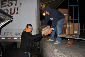 Brian Woods hands hams to Robert Craigle.