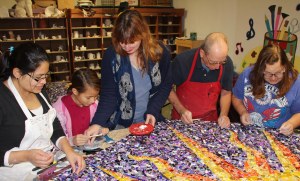 Working together on the time-consuming project are, from left, Marcia Shellhammer, Izabella Shellhammer, creator Kim East, clay instructor Craig Bulger, and Irene Miller. Numerous others helped, but aren't pictured.