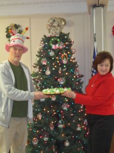 In addition, board President Bernie received a birthday cake. Also pictured is secretary Anna Mary.