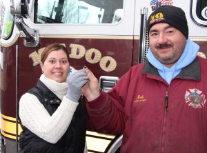Jessica Navitsky, Tamaqua, hands over the wedding ring to Robert Leshko, son-in-law of ring's owner.