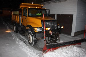 Borough crews plow a road in Dutch Hill Thursday morning.