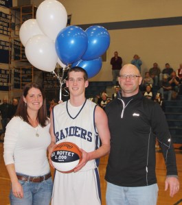Pictured is Bo Rottet with mother Kim and father Tom immediately after scoring his 1,000th point.