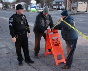 Pictured closing Maple Street are Rush Township Police Sergeant Duane Frederick and Hometown Fire Police volunteers Joe Shamonsky and captain Merle Wertman. 