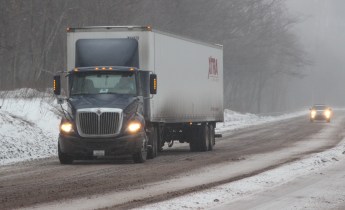 A tractor-trailer driver struggles to get traction on SR309 in Kline Township. 