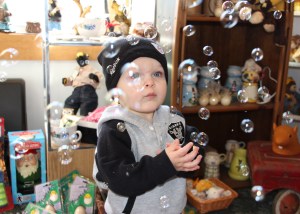 While in the store, 1-year-old Jensen Long surrounds himself with bubbles he can touch. He is the son of Edward and Courtney Long of Ashland.