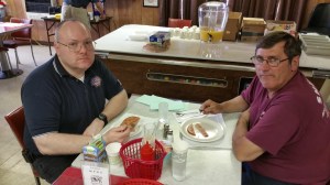 Shawn Phillips and Richard Sinton enjoy their breakfast at the post.