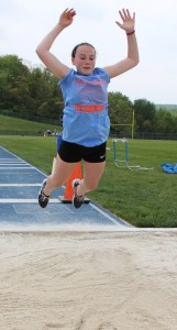 Caroline Balogash, 12, leaps during the long jump. She placed top with 6 feet 6.5 inches.
