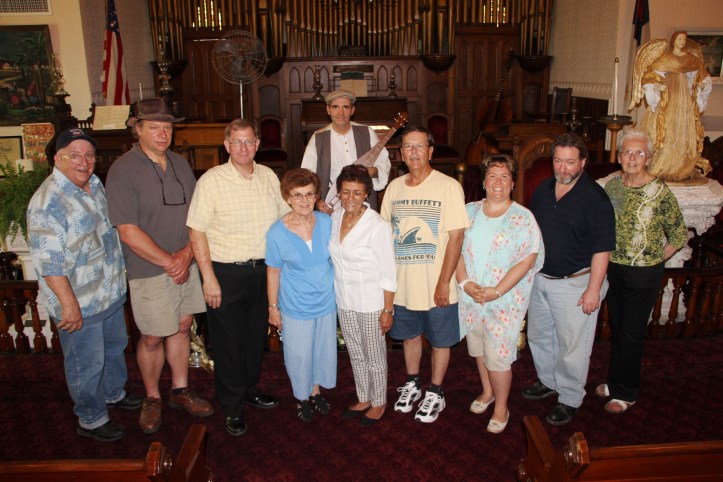 Pictured from left are Gene Pirone, Jenny Pirone, Bruce Marcovage, LHS President Bill Harleman, Louise Solomon, Jenny Piron, Glenn Wagner, Heather Wagner, Mike Cannon and . In back is musician Dave Matsiako - playing at mountain dulcimer.