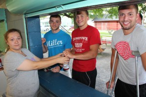 Amy Sell serves snacks and refreshments to ESRC basketball tournament players Michael Nesgoda of Summit Hill, Jake Kusko of Lansford, and Zach Stanko of Nesquehoning.