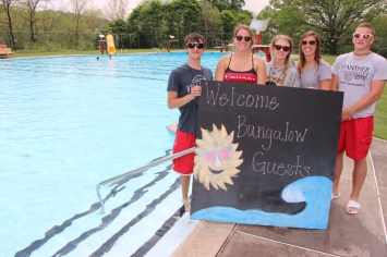 Pictured during a lunch break are some Lansford lifeguards holding a sign that reads, 