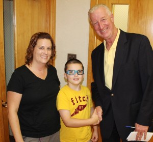 Pictured are Keenan, 8, his mother Shanna Cook, and Tamaqua Borough Councilman Dan Evans.