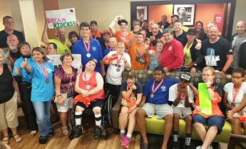 Athletes with Special Olympics of Schuylkill County and riders with the Dream Ride come together for a group photo.