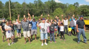 Mine tours guest hold their hands up while being questioned by Civil War reenactors during the event.